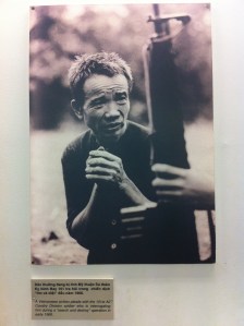 A Vietnamese civilian pleads with an American soldier during interrogation