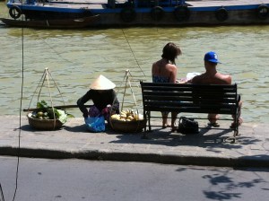 Couple buying mangoes from a local vendor, Hoi An